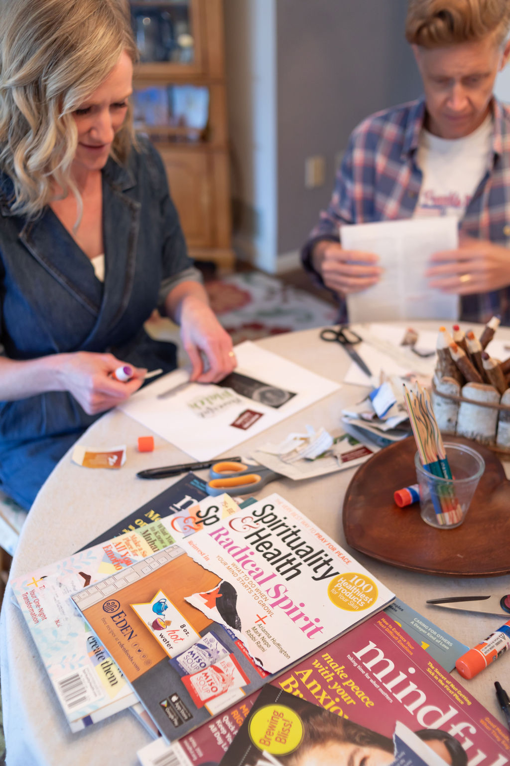 Participants creating personalized vision boards based on their astrological signs during Angel Living’s free workshop.